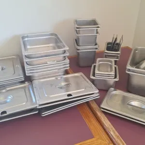 Assorted stainless warming/ chilled trays.