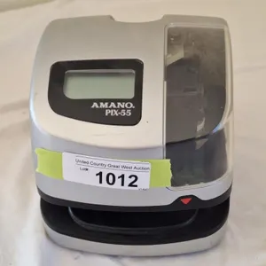 Amano PIX-55 electronic time clock. Powers on