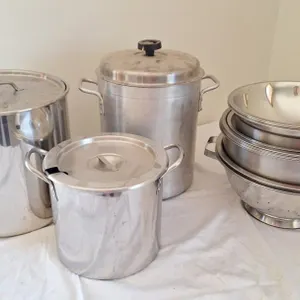 Stainless mixing bowls and trio of pots