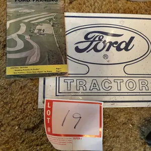 Metal Ford sign, and book