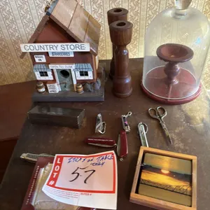 Country store, birdhouse, candleholders, manicure items, and coasters, pocket knives,