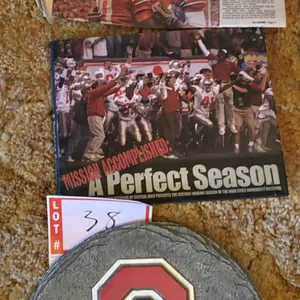 Ohio State "Perfect Season" book, Ohio State slate sign, and newspaper