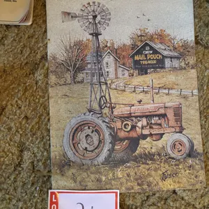 Male pouch, Farmall metal sign