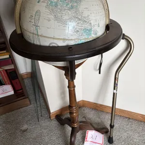 Globe and cane