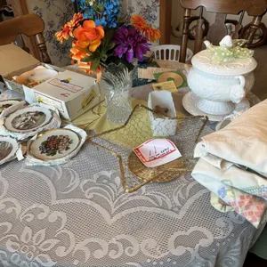Items on table, soup turrine, vase, decorative plates