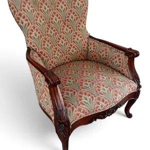 Ornate Carved Wood Armchair with Patterned Upholstery