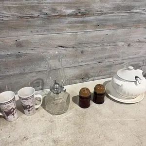 Soup serving bowl, coffee cups, salt and pepper shakers and kerosene lamps