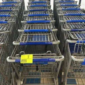 Metal wire shopping carts. Features gray metal wire construction with nesting design, blue plastic handles, child seats with safety straps, lower wire