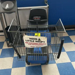 Carts and Parts, Inc. Handy Helper Electric Shopper motorized shopping cart. Features a blue molded plastic body, front wire basket, molded black seat