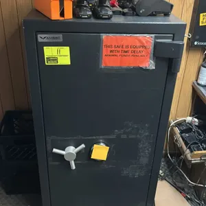 AMSEC metal office safe. Features a combination dial lock and a 3-spoke turn handle. Equipped with a time delay security warning. Combination code is 