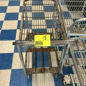 Metal 2-tier utility stock cart. Features a wire grid top shelf, a slatted bottom shelf, and an integrated push handle. 42"L. Mounted on casters. Note