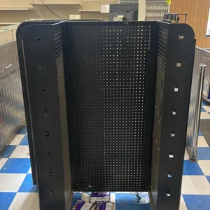 Portable candy and magazine display rack. Features multi-sided pegboard panels, angled wire product shelves, display hooks, and magazine wire organize