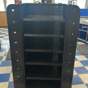 Portable candy and magazine rack. Features a black multi-sided metal frame, pegboard backing, adjustable flat shelves, wire magazine display racks, an