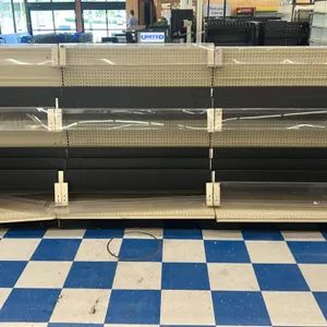 12' of Lozier wall shelving. Features a 53"H frame with 22"D base shelves, cream-colored pegboard backing, and black adjustable shelves with clear pla