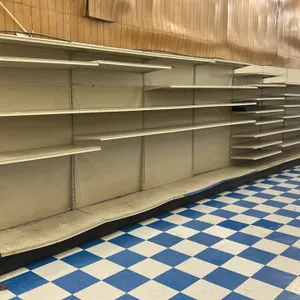 48'L of Lozier wall shelving. Features 84"H uprights, 22"D base shelves, and adjustable upper shelving. Contents not included.