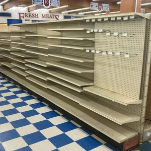 96'L of Lozier gondola shelving. Features 72"H uprights, 16" and 25" base shelves, adjustable upper shelves, beige pegboard backing, and peg hooks. Co
