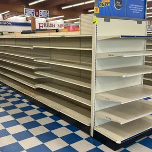 98'L of Lozier gondola shelving. 77"H uprights with 22"D base shelves. Features pegboard backing and adjustable upper shelves. Contents not included. 