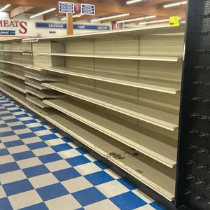 99'L of Lozier gondola shelving. 72"H uprights with 22"D base shelves. Features adjustable upper shelves and solid backing. Cream-colored finish. Cont