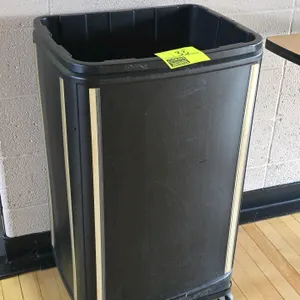 Portable insulated ice bin. Features black polyethylene construction, an interior drain with bottom external drain valve, and decorative side trim. Mo