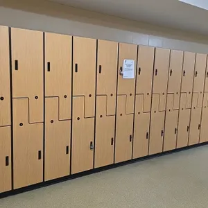 MultiSpace laminate wood 2-door lockers. Features an interlocking Z-door double-tier design, interior coat hooks, and recessed pull handles with padlo