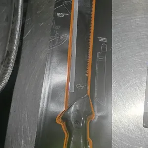 Gerber Gator dual-blade machete. Features a high-carbon steel blade with a fine edge for chopping and a serrated saw edge on the spine. Equipped with 