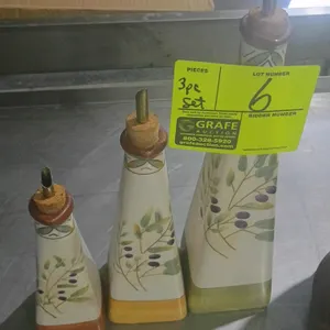 Sakura Les Olives 3-piece ceramic cruet set. Features three graduated-size bottles decorated with painted olive branch motifs and color-coordinated ba
