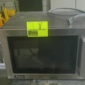 Amana commercial microwave. Features stainless steel construction, digital touch keypad with ten programmable pads, and a pull-handle door. Clean inte