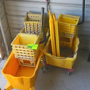 Mop buckets with wringers. Features yellow plastic construction, manual wringer attachments, and rolling casters. Includes two folding yellow plastic 