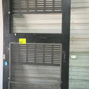 Wood screen door. Features a black painted finish, metal screen mesh, slotted metal grilles, and pre-attached hinges and pull handle. Dimensions: 38"W