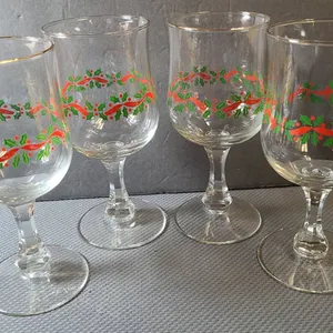Four Holiday-Themed Stemmed Glasses with Holly and Ribbon Motif, Gold Rim Accents, Clear Glass