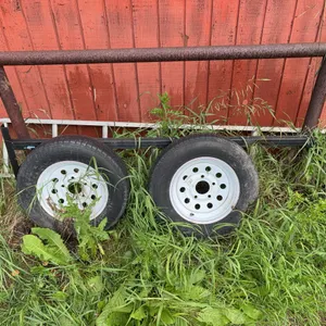 Pair of 14.5R12 Trailer Tires on White Steel Rims with Misc.