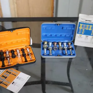 Two thread repair kits including metric and imperial
