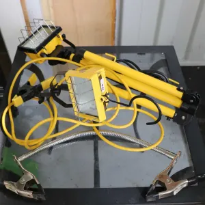 Two halogen work lights, one stand, and joined clamps