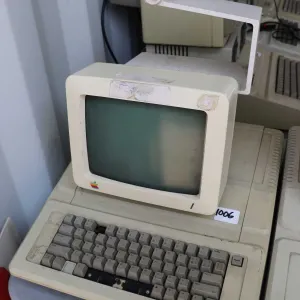 Vintage 1980s Apple IIE with Apple Monitor and stand. See photos for internals , untested at time of