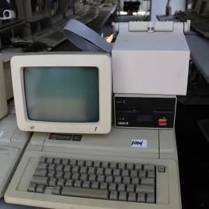 Vintage 1980s Apple IIE with Apple Disk II disk drive, Apple Monitor and stand. See photos for inter