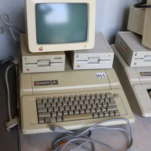 Vintage 1980s Apple IIE with two Apple Disk drives and Apple Monitor. See photos for internals , unt