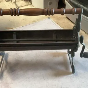 Vintage cast newspaper log roller