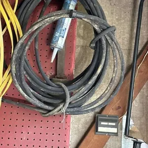Water hose. Black and caulk gun