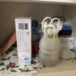 Cabinet lower shelf contents. Straws. Band aids