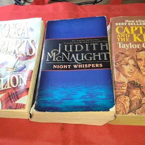 Three Paperback Novels: Rebellion by Nora Roberts, Night Whispers by Judith McNaught, Captains and t
