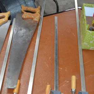 2 Handsaws, 4 Carpenter's Clamps (2 are 3 ft, 2 are 2ft), Box of Screwdrivers