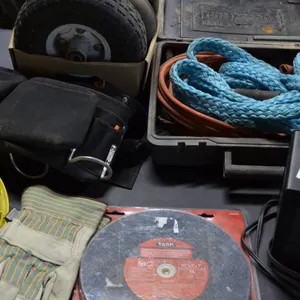 Small Tire 4.10/3.5-4, 3 Small Tubes, Yellow Hard Hat, Black Carpenters Belt, Heater, Tow Rope, Booster Cables, One Task 10" x 1" x 1" Grinding Wheel,