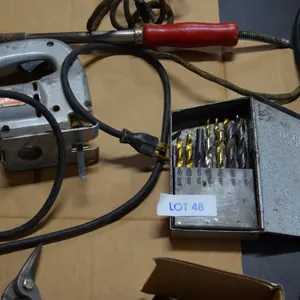 Box full of Tin Snips, Black and Decker Jigsaw, Hot Iron, 3/8" Black and Decker Drill, Drill Bits (not complete), Chuck cable Extender, Red Box of All