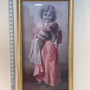 Young Girl Holding Baby or Doll