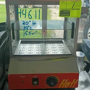 Benchmark Hotspot hot dog steamer. Features stainless steel construction, sliding glass doors, perforated trays, and a 'Hot Dogs' graphic header. Equi