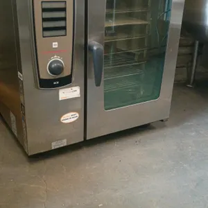 Henny Penny SmartCooking System SCE stainless steel self-cooking combi oven. Features a glass door, digital control panel, and ten interior racks. Dim
