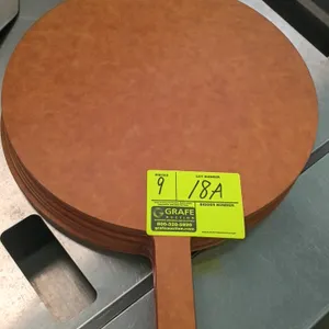 Pizza peels. Features wood composite construction with a circular blade and integrated handle. 15" diameter.