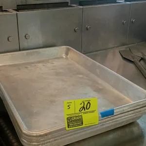 Aluminum roaster pans. Features durable aluminum construction with a beaded rim. 18" x 26". Note: Pans exhibit denting.