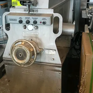 Hobart MG1532 commercial meat mixer grinder. Features stainless steel construction, an internal mixing paddle, feed auger, and an integrated control p