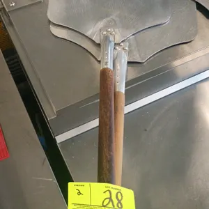Aluminum pizza peels. Features aluminum blades secured with triple-rivet connections to wooden handles.